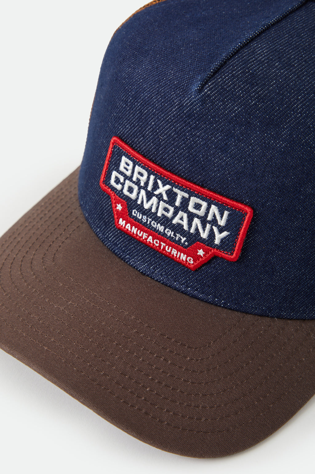 Brixton Reeves Netplus Trucker Hat in WASHED DENIM/CARAMEL