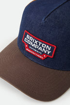 Brixton Reeves Netplus Trucker Hat in WASHED DENIM/CARAMEL